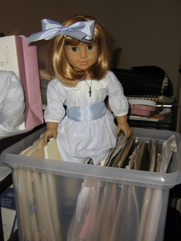 Nellie tucked herself into some files.