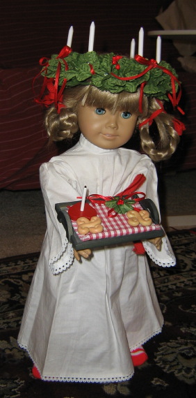 Kirsten holds her St. Lucia tray, wearing her St. Lucia outfit.