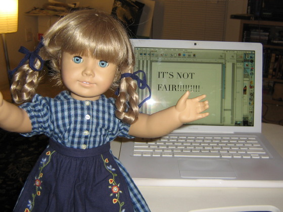 Kirsten stands in front of the computer, having typed "IT'S NOT FAIR!!!"