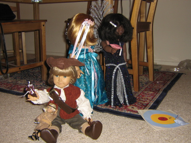 Kirsten eats candy while May and Nellie play beanbag toss.