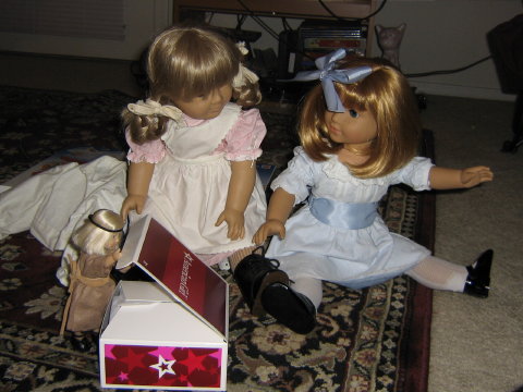 Mini Kit opens the box while Kirsten is sad. Nellie tries to comfort her.